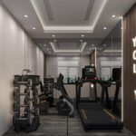 Home gym with mirrors and carefully arranged exercise equipment, view 1